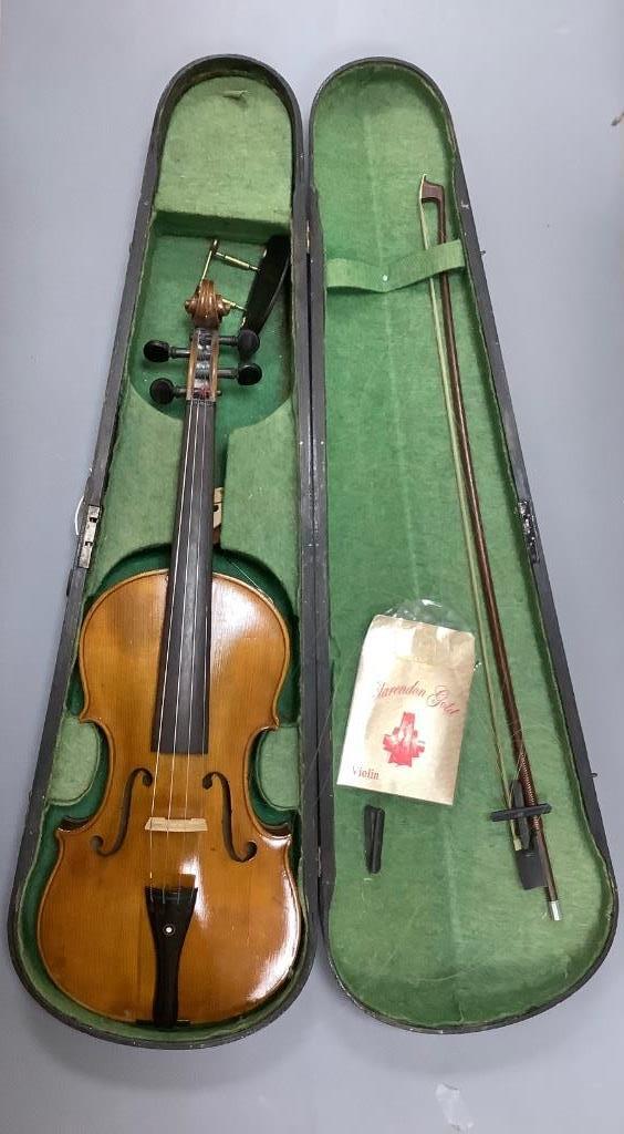 An early 20th century violin, unlabelled case, with bow, length 60cm